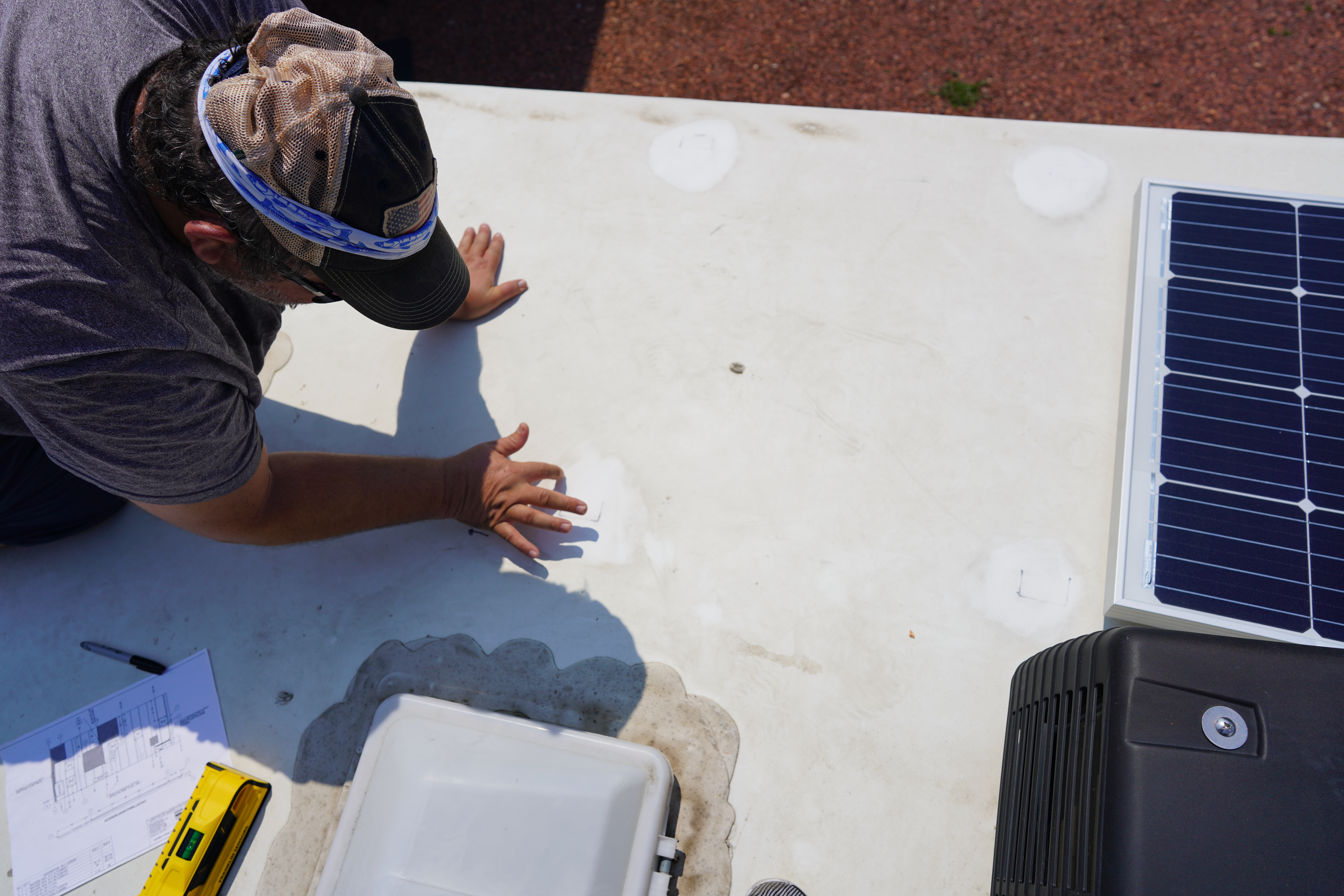 Preparing the RV’s roof for sealing and mounting the panels