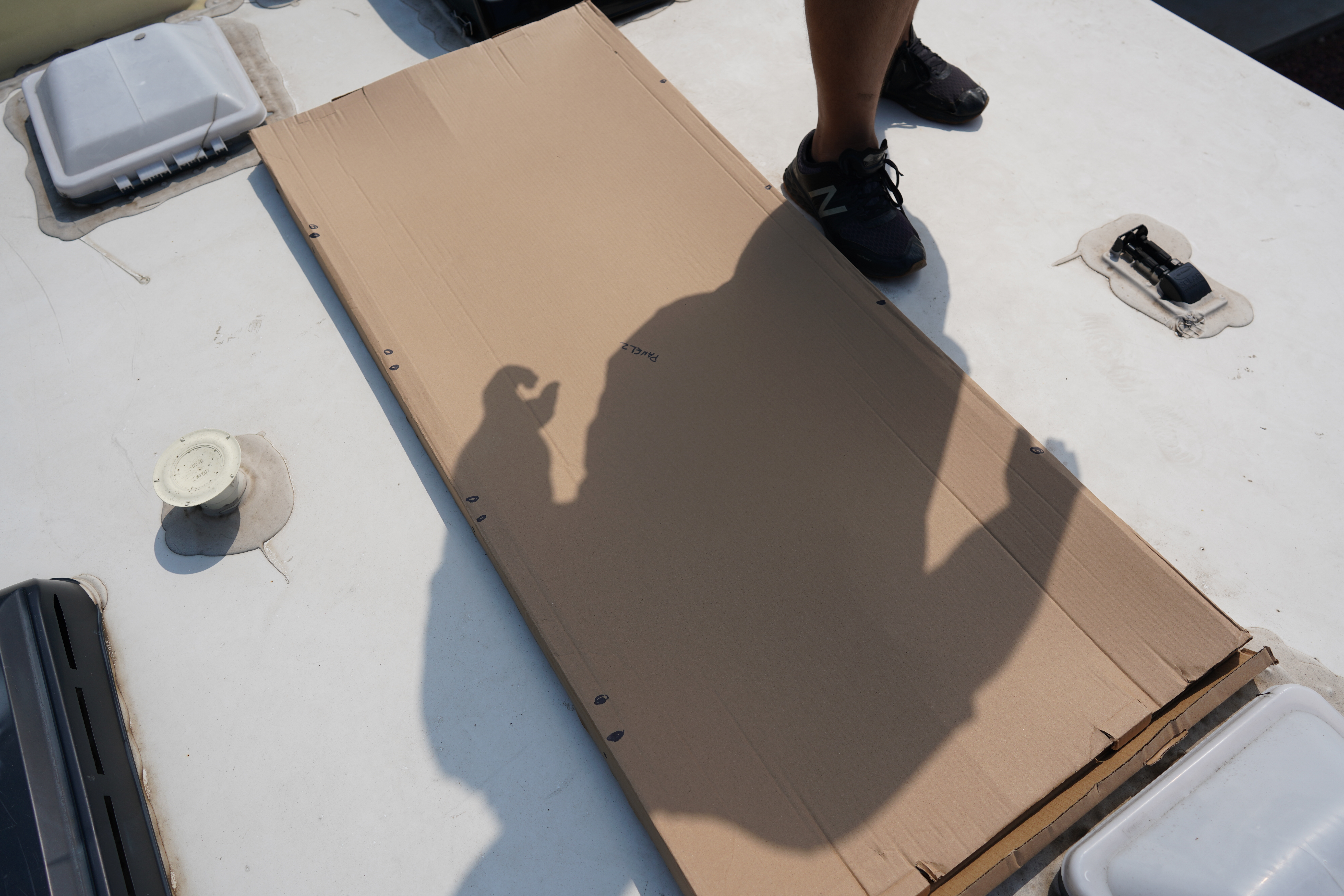 Using the boxes from the solar panels to layout and cover the panels duting installation